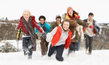 teens running in snow
